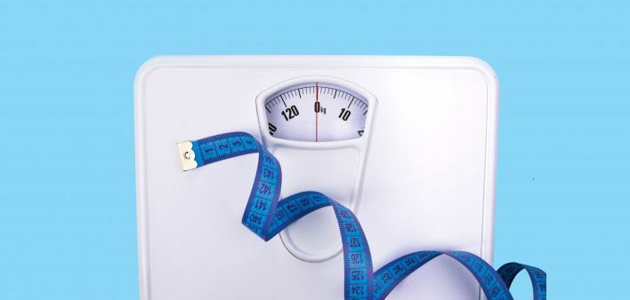 scale and blue tape measure weight