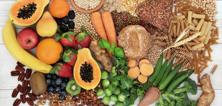 food with high fiber content for a healthy diet with fruit, vegetables, whole wheat bread, pasta, nuts, legumes, grains and cereals