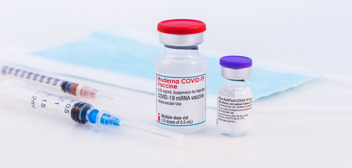 Pfizer BioNTech and Moderna Covid-19 vaccine on a white background.