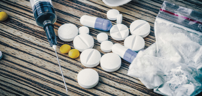 syringe and pills