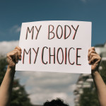 Woman holding a sign My Body, My Choice