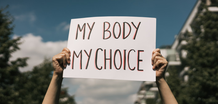 Woman holding a sign My Body, My Choice