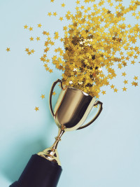 trophy with stars coming out