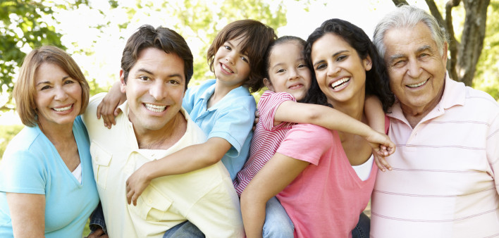 A multi-generational latin family having fun outdoors