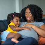 pregnant mother and young girl