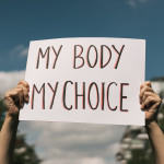 Woman holding a sign My Body, My Choice