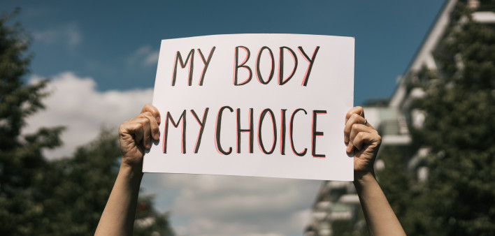 Woman holding a sign My Body, My Choice