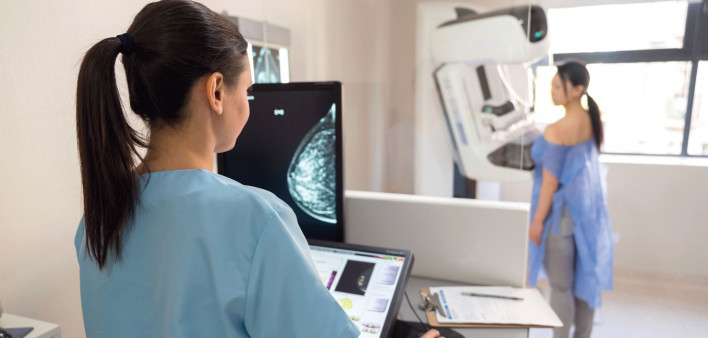 mammogram tech and patient