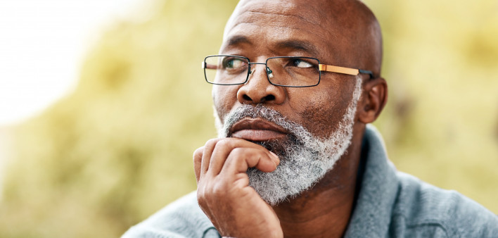 senior man outdoors thinking