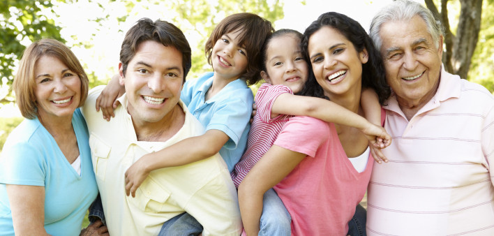 A multi-generational latin family having fun outdoors