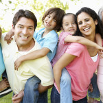 A multi-generational latin family having fun outdoors
