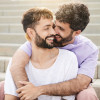 happy gay couple embrace