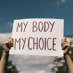 Woman holding a sign My Body, My Choice