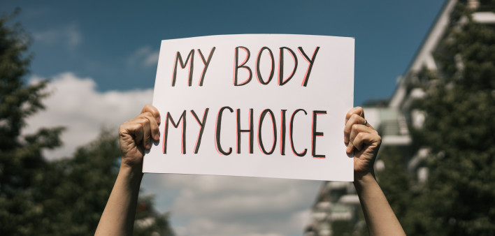 Woman holding a sign My Body, My Choice
