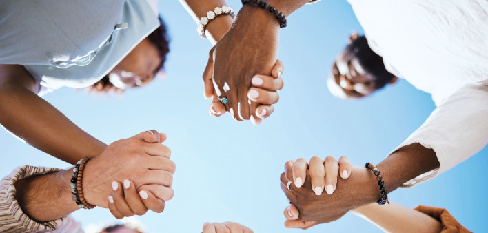 group of people holding hand to form a circle support