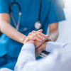hands of nurse and patient