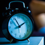 Asian man in bed suffering insomnia and sleep disorder thinking about his problem at night