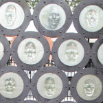 The New Orleans AIDS Memorial, designed by Tim Tate, features multicultural cast glass faces. Unveiled in 2008, it’s located in Washington Square Park in the Marigny neighborhood.