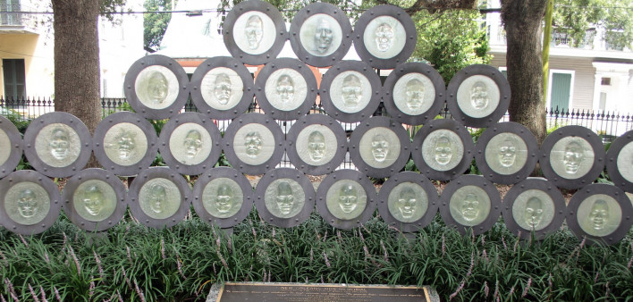 The New Orleans AIDS Memorial, designed by Tim Tate, features multicultural cast glass faces. Unveiled in 2008, it’s located in Washington Square Park in the Marigny neighborhood.