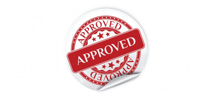 A red and white seal of "Approval"