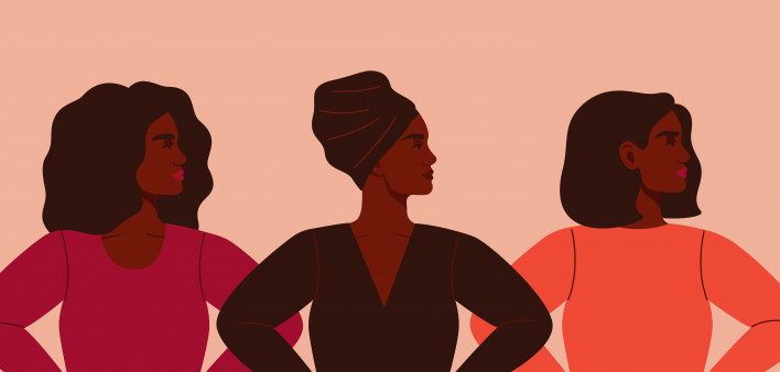 Three strong African women stand together. Concept of fighting for equality and female empowerment movement.