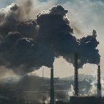 Ecological catastrophy smokestacks billowing smoke