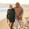gay couple walking on the beach