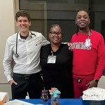 Thomas Dobbs (left) and colleagues representing the University of Mississippi Medical Center at an outreach event