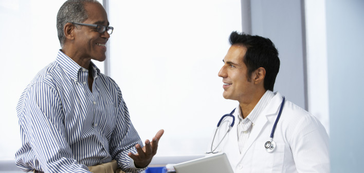 POZ Health Info Poster Slideshow Doctor talking With Male Patient Using Digital Tablet