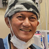Gerardo Bada poses with Edmond Marzbani, MD, before chemotherapy at Fred Hutch Cancer Center–Northwest.