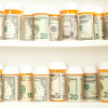 pill bottles with money as labels cost of healthcare