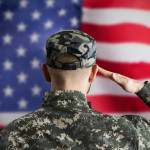 Military US Soldier Saluting Flag. Army Veteran