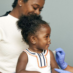 little girl and mother vaccine