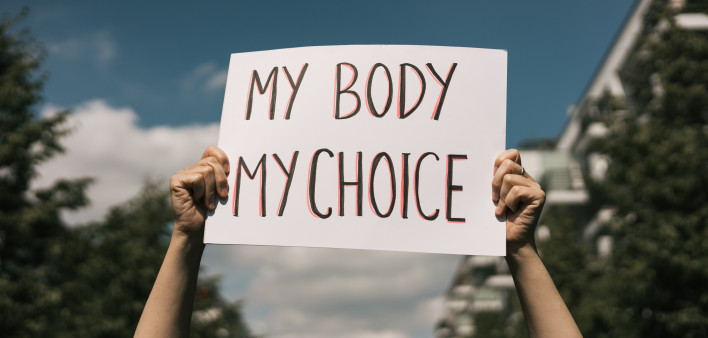 Woman holding a sign My Body, My Choice