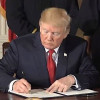 Trump signs executive order.