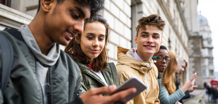 Teenagers students using smartphone on a school break
