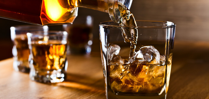 whiskey and natural ice on old wooden table