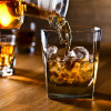 whiskey and natural ice on old wooden table