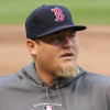 Bobby Jenks pitches with the Boston Red Sox before a game in 2011.