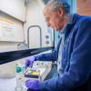 Fred Hutch microbiologist Steven Henikoff prepares paraffin-embedded slides in lab.