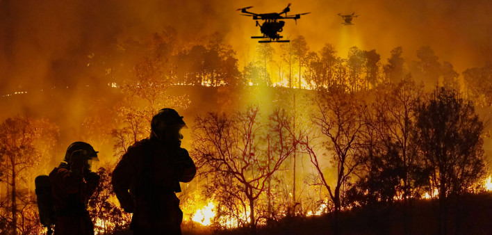 Firefighting drones spray chemical to help control wildfires