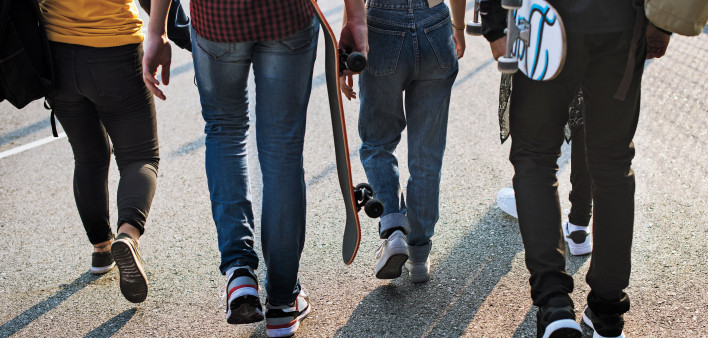 teen skateboarders walking  legs