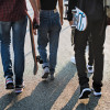 teen skateboarders walking  legs