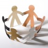 paper cut out dolls joined hands in a circle