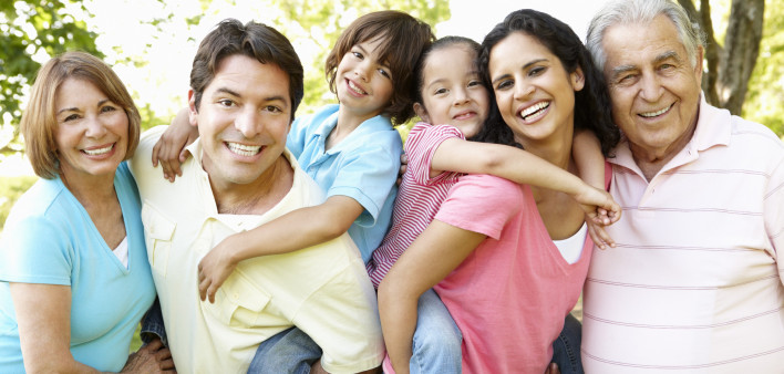 A multi-generational latin family having fun outdoors