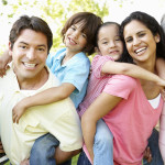 A multi-generational latin family having fun outdoors
