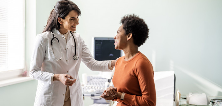 Female medical practitioner reassuring a patient