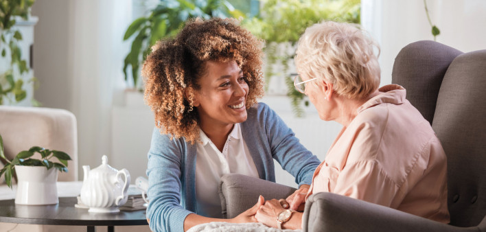 caregiver and elderly woman patient, nurse