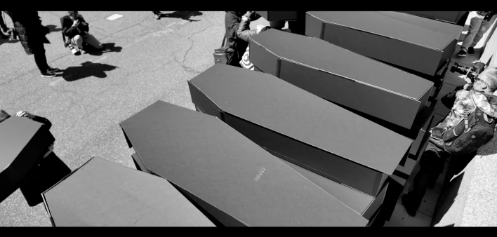 AIDS activists deliver a mountain of coffins April 2025 to the State Department in defense of global HIV program PEPFAR.