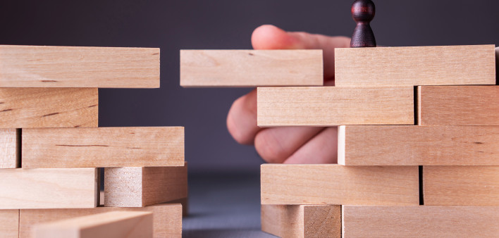 wooden blockes stacked bridge hand